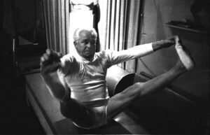 NEW YORK - OCTOBER 1961: Joe Pilates, Inventor, physical fitness guru and founder of the Pilates exercise method demonstrates his techniques in his 8th Avenue studio on October 4, 1961 in New York City, New York. (Photo by I.C. Rapoport/Getty Images)